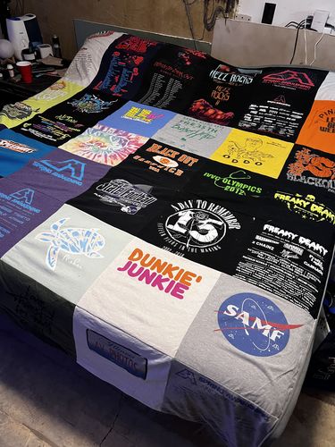 T-shirt quilt with music festivals, events themes by Kylie from IL