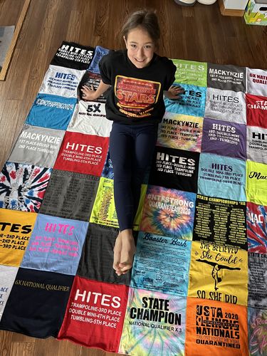 T-shirt quilt with cheerleading, trampoline themes by Natasha from IL