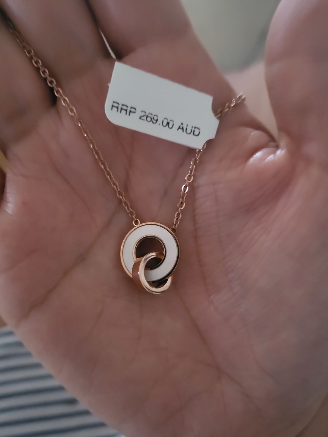 Customer photo review of Genuine Single Diamond Set Roman Numerals & MOP Shell Dial Necklace Rose Gold Titanium