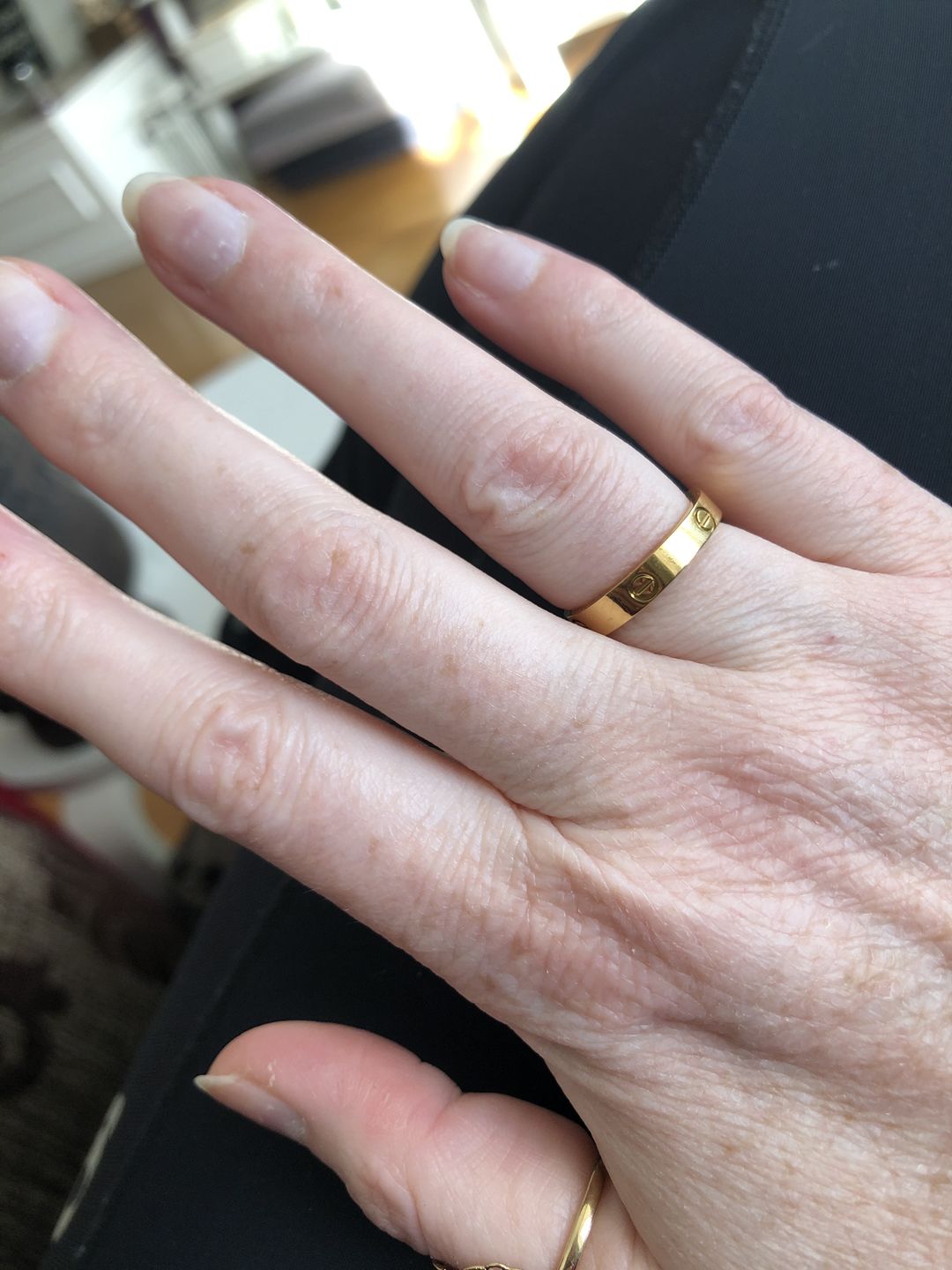 Customer photo review of Modern Promise Cartier Band Ring in Gold