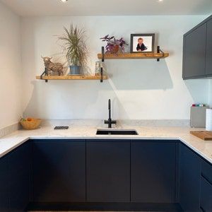 Customer photo review of Rustic Wooden Wall Shelves with Triangle Metal Wall Brackets