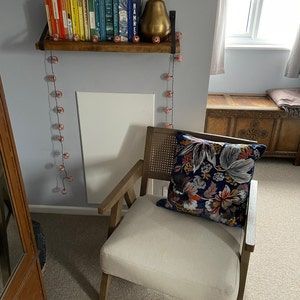 Customer photo review of Rustic Wooden Wall Shelves with Triangle Metal Wall Brackets