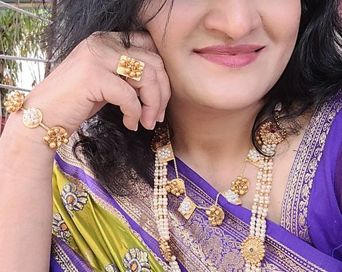 Customer photo review of Rubans 24 K Gold Plated Handcrafted Necklace Set With Pearls And Golden Beads.