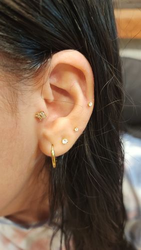 Customer photo review of PIERCING MARIPOSA BAÑO DE ORO