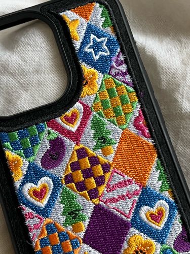 Customer photo review of Embroidered Rhombus Lattice Love Heart iPhone Case