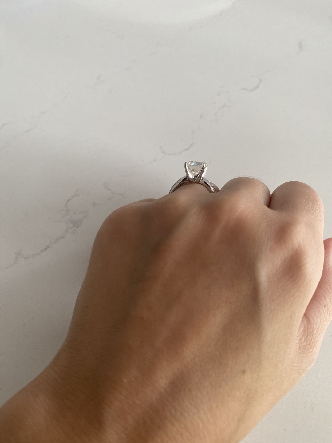 Customer photo review of Classic Solitaire Round Moissanite Four Prong Engagement Ring