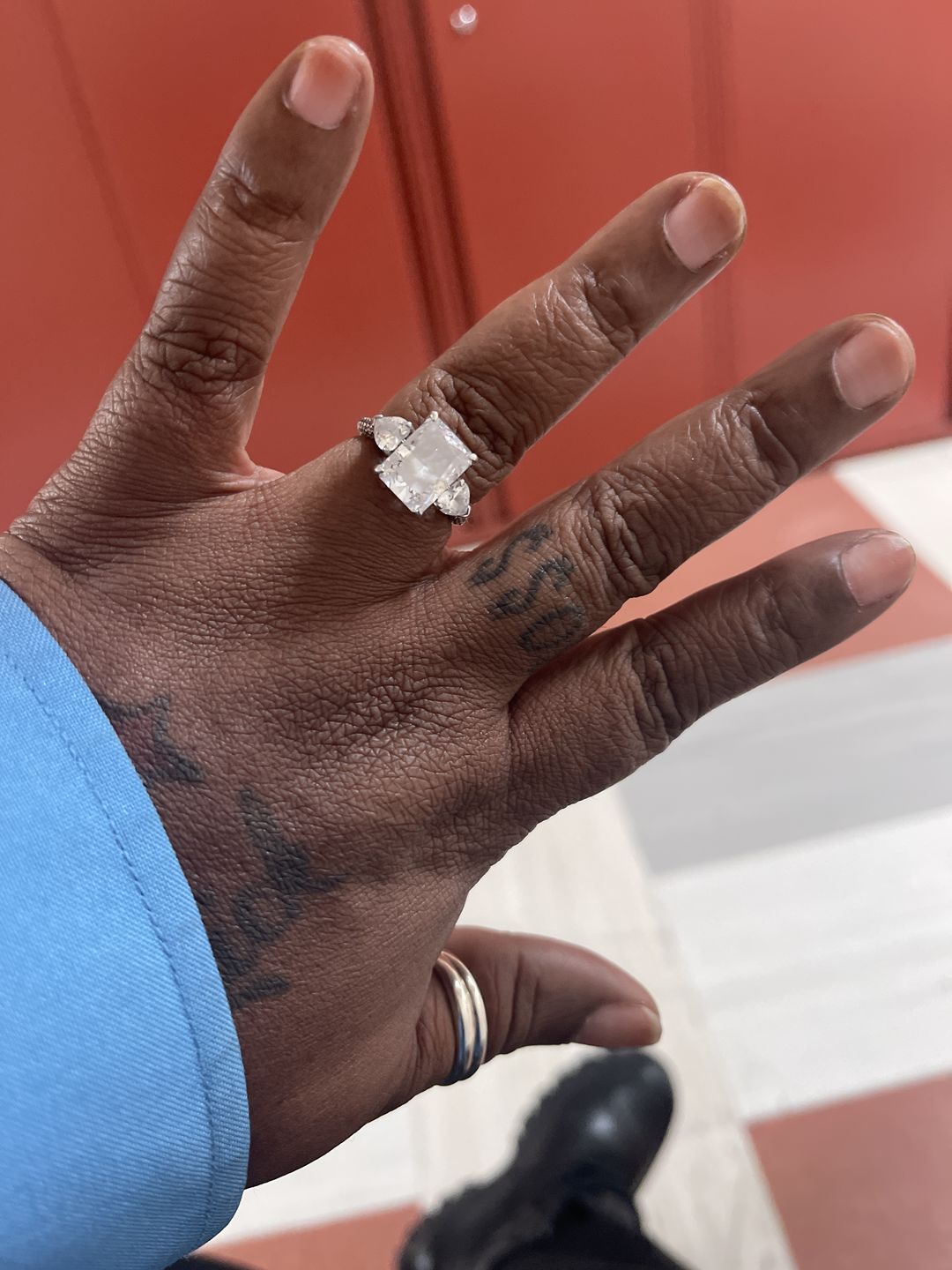 Customer photo review of Louily 5.0 Carat Radiant Cut Three Stone Engagement Ring With Two Heart Cut Side Stones