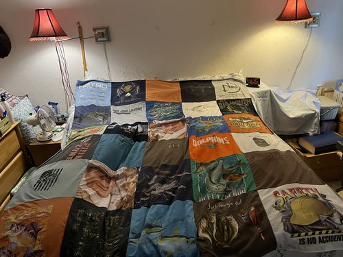 T-shirt quilt with fishing, marine life themes by Vicki from FL