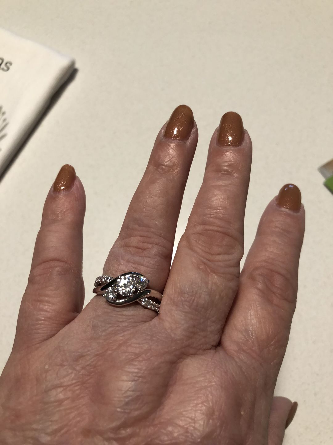 Customer photo review of Swirl Three Stone Moissanite Twisted Pave Engagement Ring
