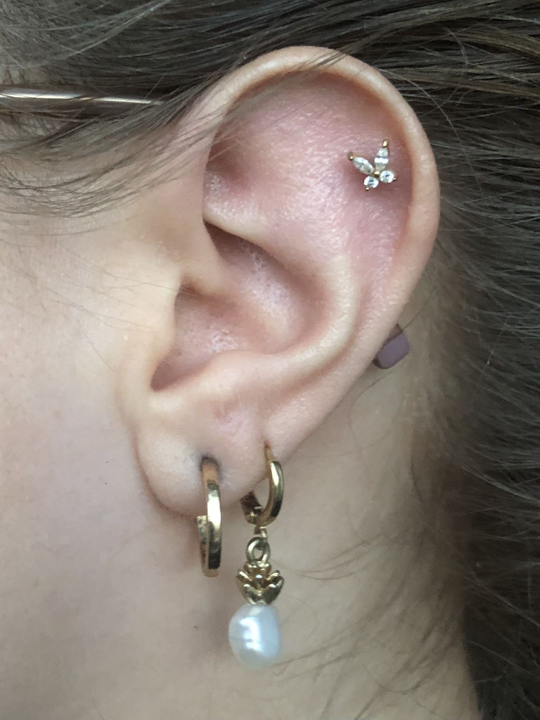 Customer photo review of Butterfly Piercing | Titan
