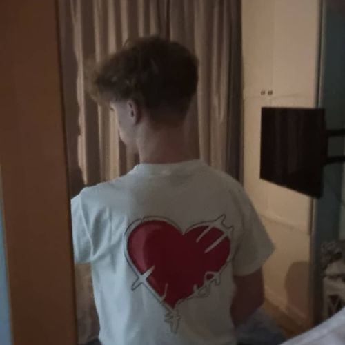 Customer photo review of WHITE RICH LOVE TEE