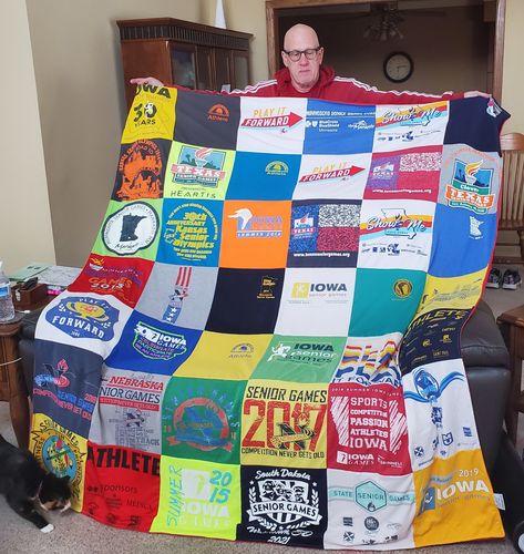 T-shirt quilt with sports, community service themes by Sheryl from IA