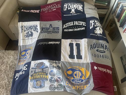 T-shirt quilt featuring aquinas football by Jake from CA