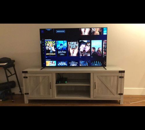Customer photo review of 58 Inch Wood TV Stand Sliding Barn Door TV Cabinet with Adjustable Shelves Storage Light Gray