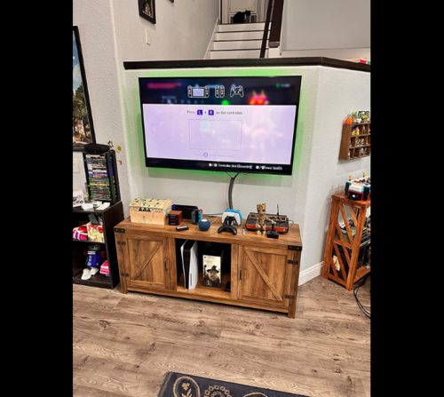 Customer photo review of 58 Inch Wood TV Stand Sliding Barn Door TV Cabinet with Adjustable Shelves Storage Light Gray