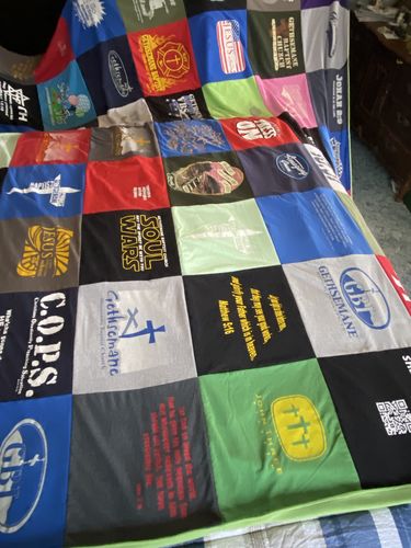 T-shirt quilt with religion, community service themes by Debbi from AK
