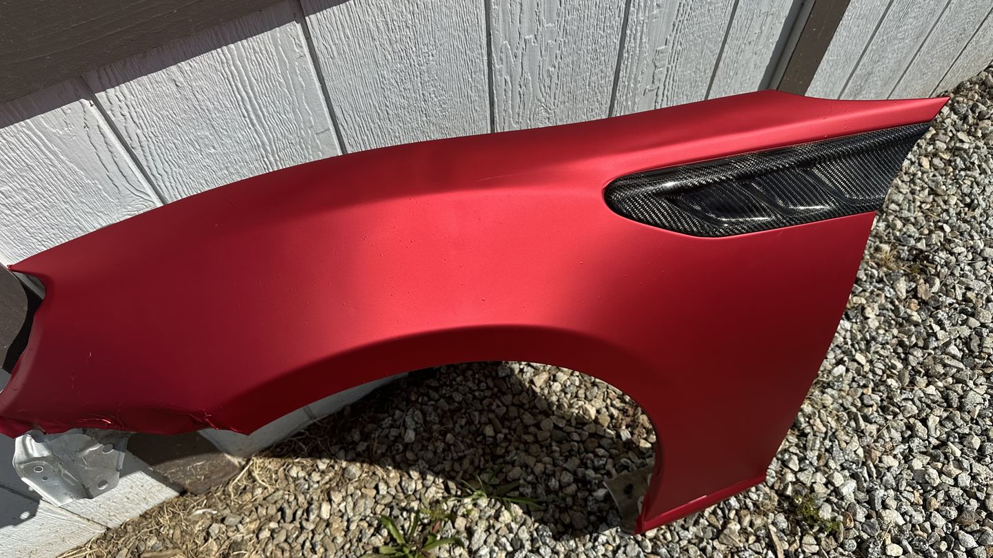 Customer photo review of Satin Chrome Prismatic Red Vinyl Wrap