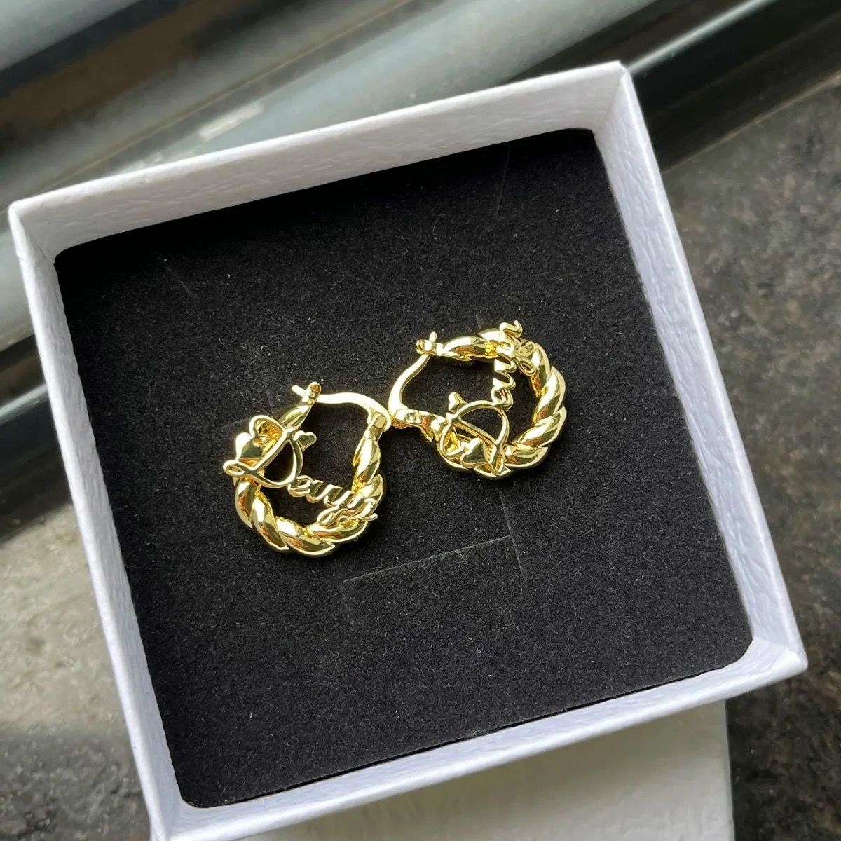 Customer photo review of Girl's Twisted Hoop Name Earrings