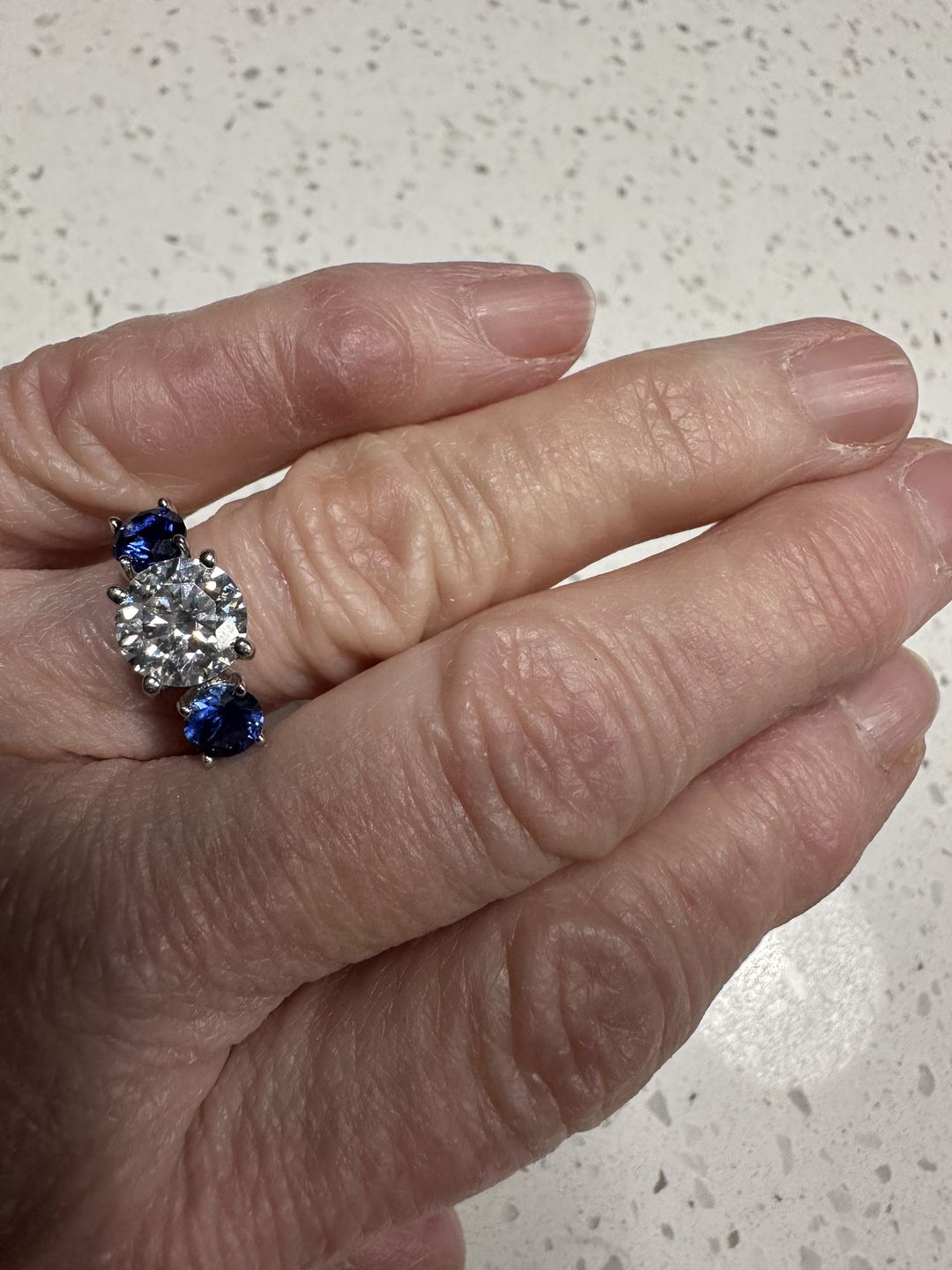 Customer photo review of Three Stone Moissanite and Blue Sapphire Pave Engagement Ring