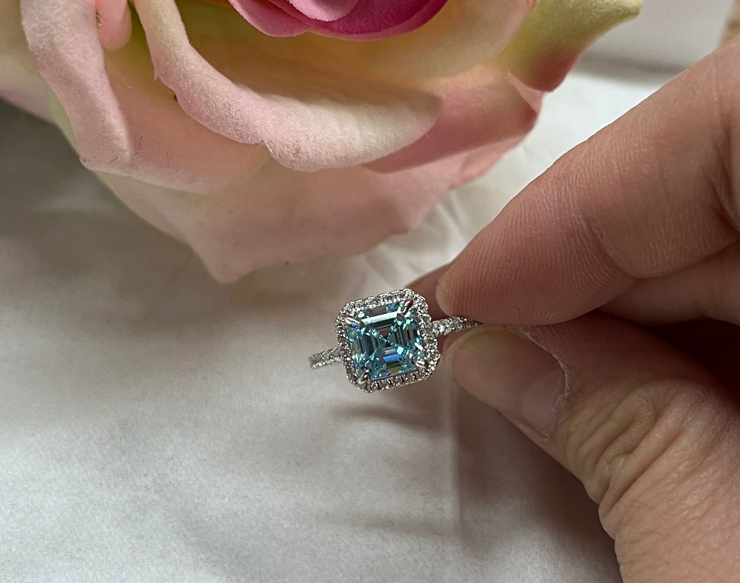 Customer photo review of Louily 2 Ct Exclusive Halo Asscher Cut Light Aquamarine Blue Engagement Ring