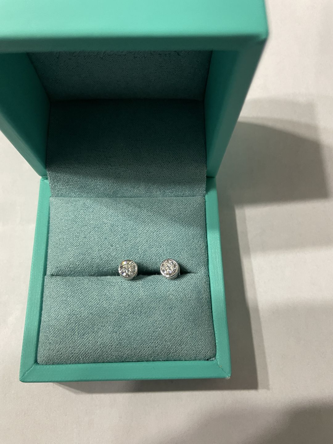 Customer photo review of Round Moissanite Bezel Set Sterling Silver Earrings