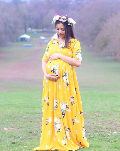 Customer photo review of Hello Yellow Floral Maternity & Nursing Crepe Wrap Dress
