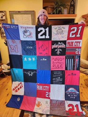 T-shirt quilt with sports, community involvement themes by Priscilla from PA