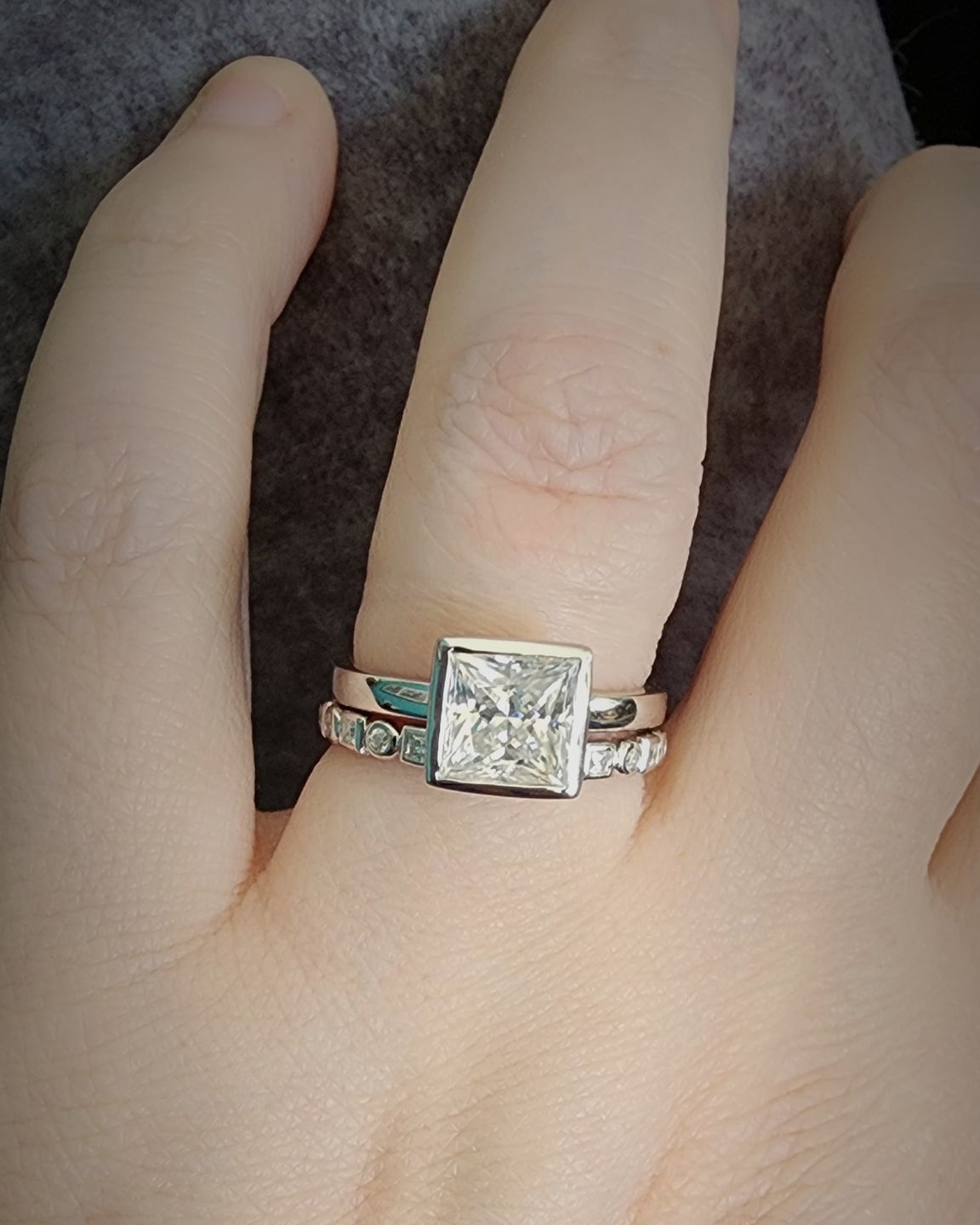 Customer photo review of Alternating Round And Princess Cut Moissanite Bezel Set Half Eternity Wedding Band