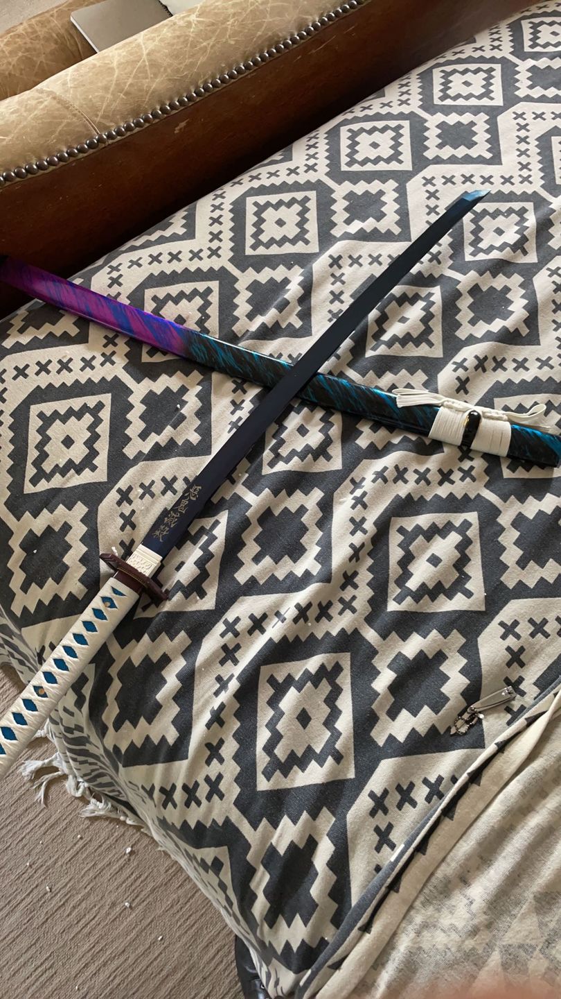 Customer photo review of The Giyuu Tomioka Handmade Katana Clay Tempered T10 Steel From Demon Slayer