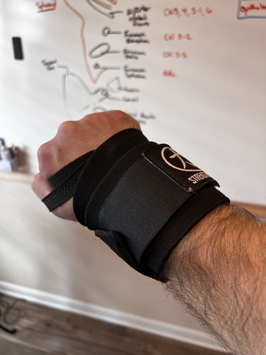 Customer photo review of Strength Shop Super Stiff Wrist Wraps - Black - USPA & IPF Approved