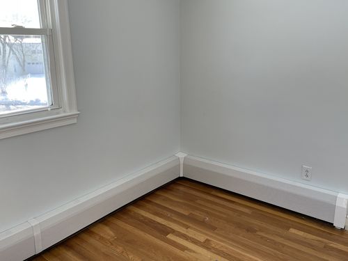 Customer photo review of Tall White Baseboard Covers by the Foot
