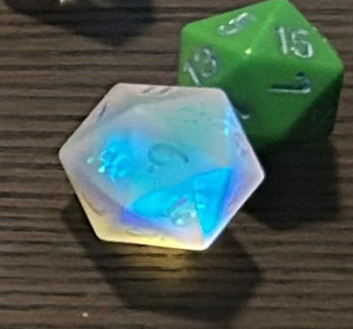 Customer photo review of Raised Fantastic Glass Moon DnD D&D Dice Set