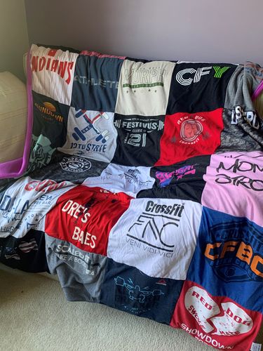 T-shirt quilt with sports, fitness themes by Ana from NC