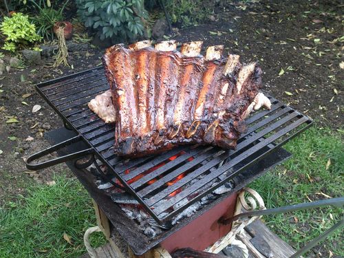 Reseña con foto de un cliente sobre Costillas