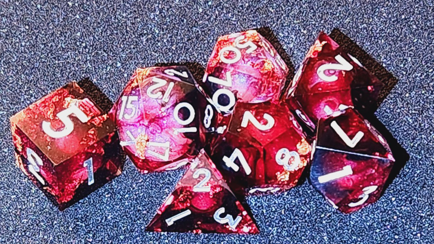 Customer photo review of URWizards D&D Bloody Liquid Heart Resin Engraved Dice Set Copper Flakes