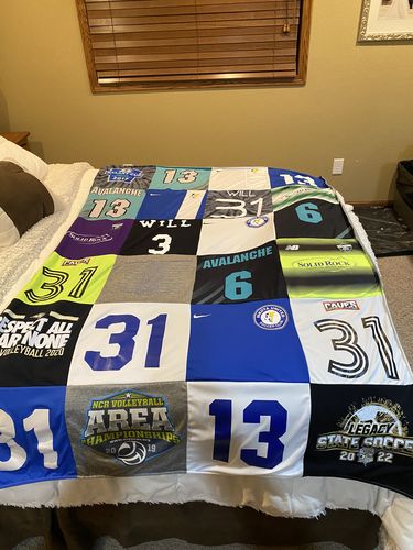 T-shirt quilt with volleyball, soccer themes by Stacey from ND