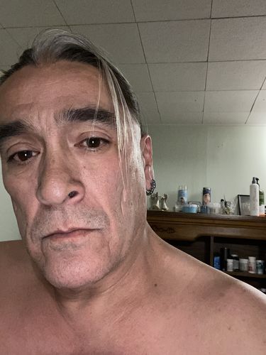 Customer photo review of Ominous Skulls Earrings