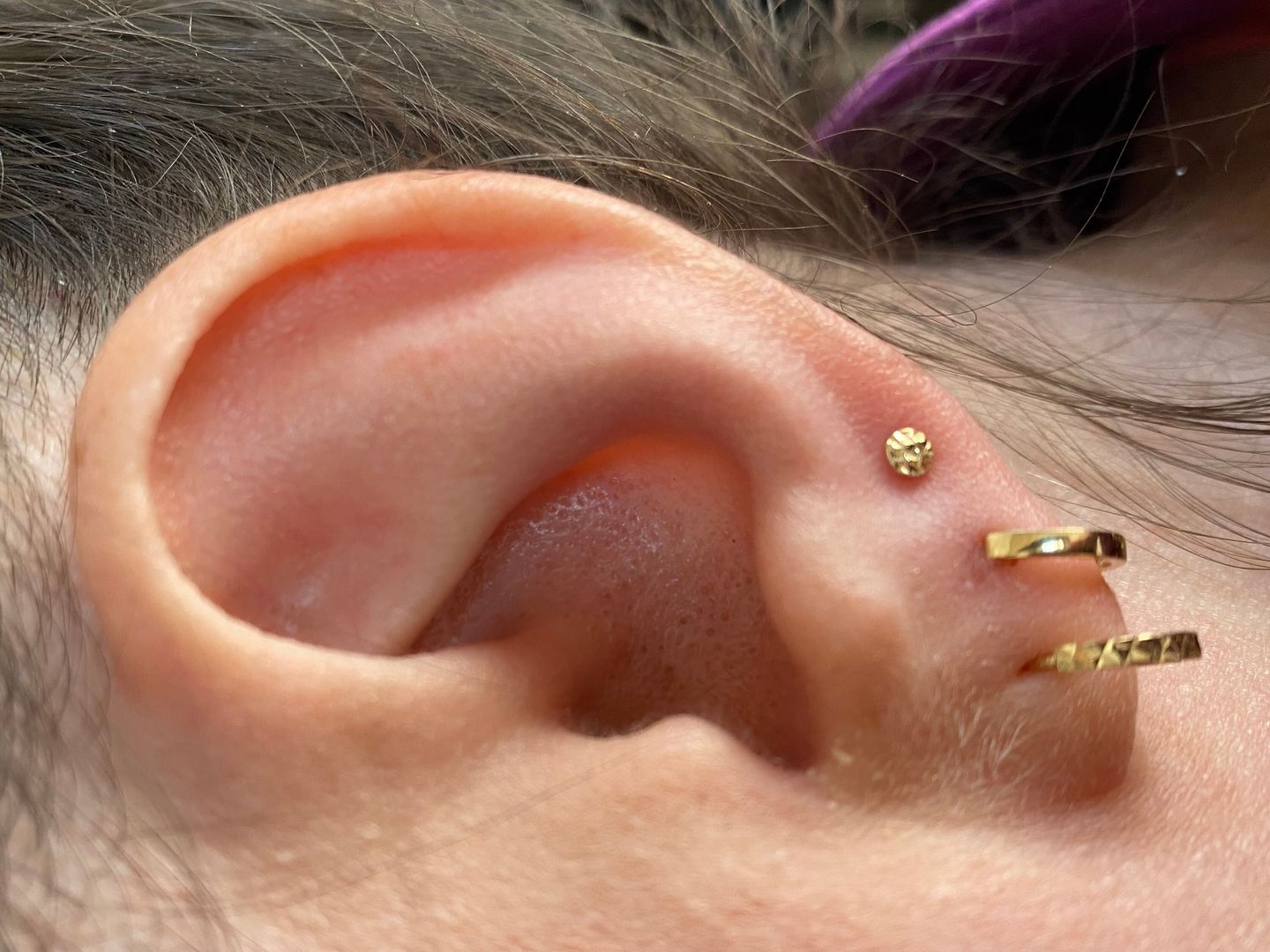 Customer photo review of Diamond Cut Huggie Hoop Earrings, Solid 14K Gold