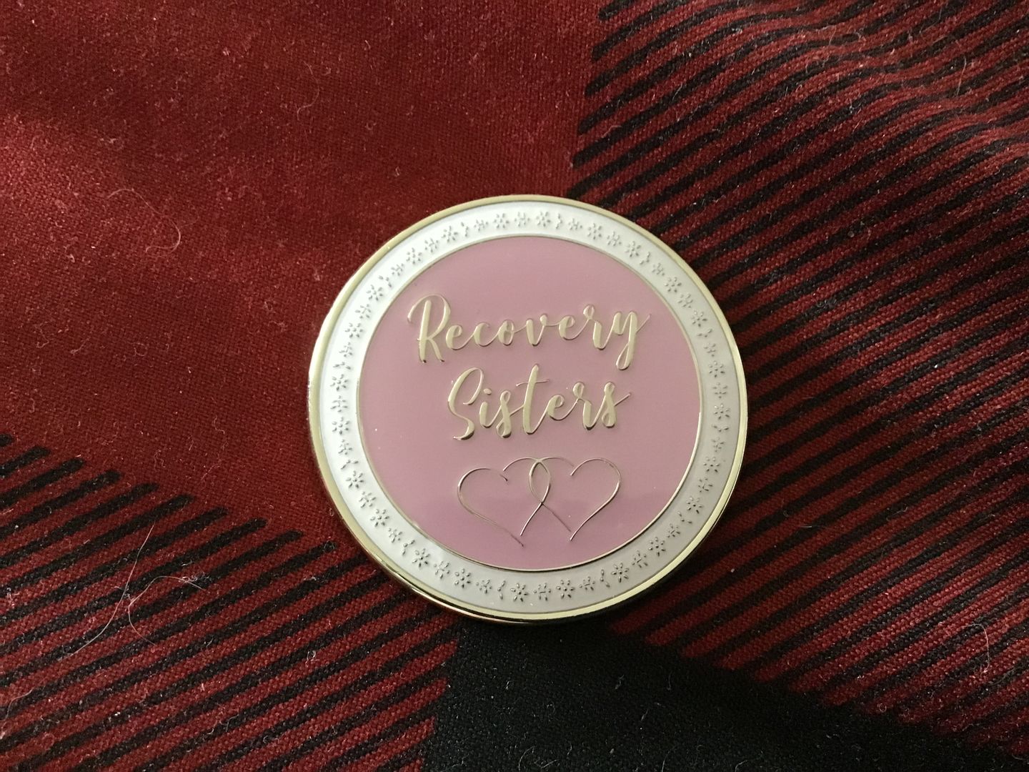 Customer photo review of Recovery Sisters - Never Alone AA/NA Affirmation Sobriety Medallion - Pink/White