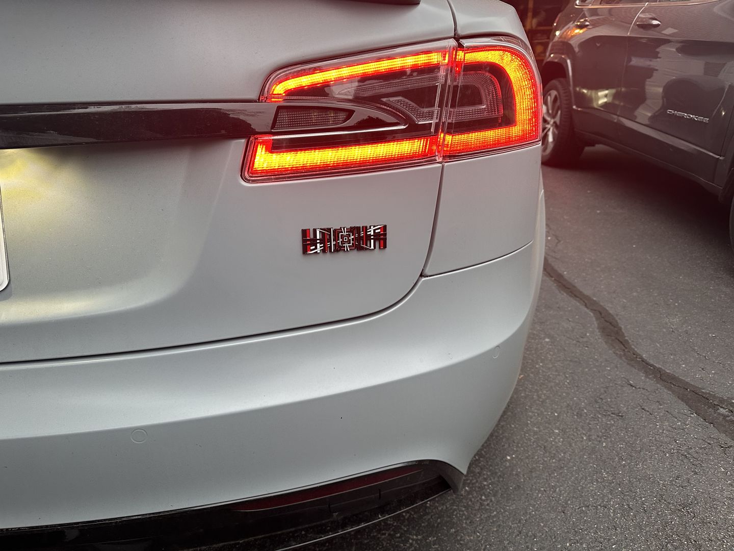 Customer photo review of PLAID EMBLEM TRUNK BADGE STICKER FOR TESLA