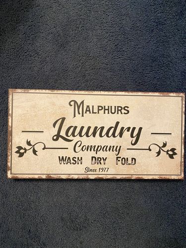 Customer photo review of Family Laundry Company Sign
