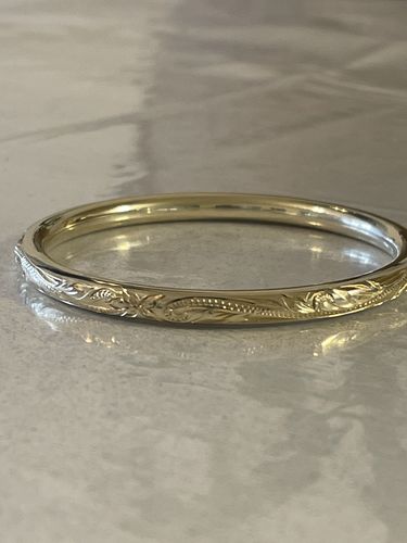 Customer photo review of Sterling Silver Yellow Gold Plated Hawaiian Scroll Round Band Hollow Bangle 5.5mm