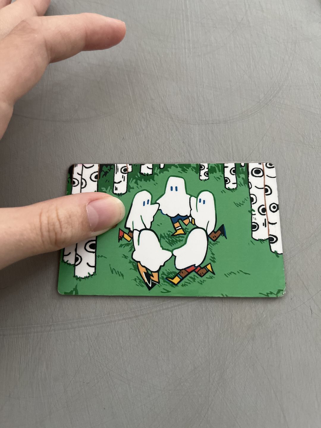 Customer photo review of Circle Ghosts Credit Card Skins