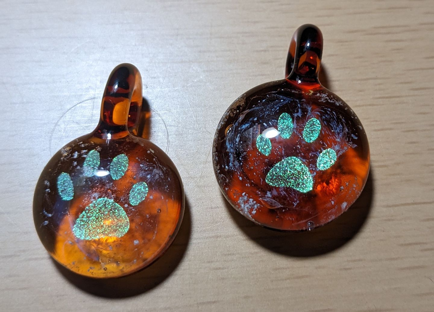 Customer photo review of Pawprint Foil Pendant with Cremation Ash