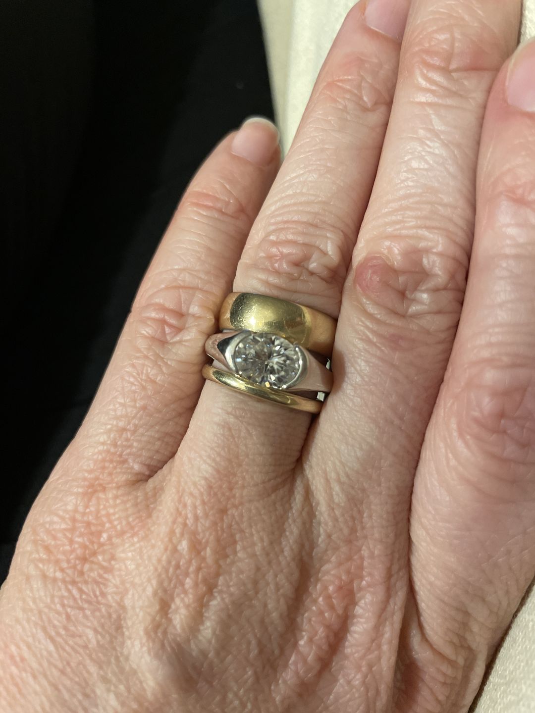 Customer photo review of Solitaire Oval Moissanite Half Bezel Set Engagement Ring