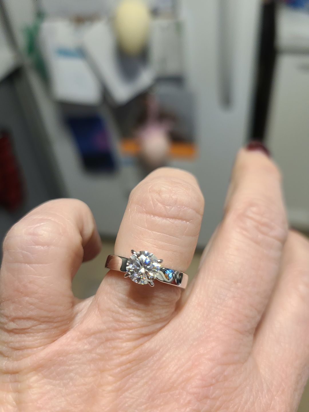 Customer photo review of Solitaire Moissanite Four Prong Flat Shank Engagement Ring