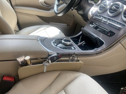 Customer photo review of Car Seat Gap Filler Organizer, Compatible with All Cars, Multifunctional PU Leather Console Side Pocket Organizer for Cellphones, Cards, Wallets, Keys KX11990