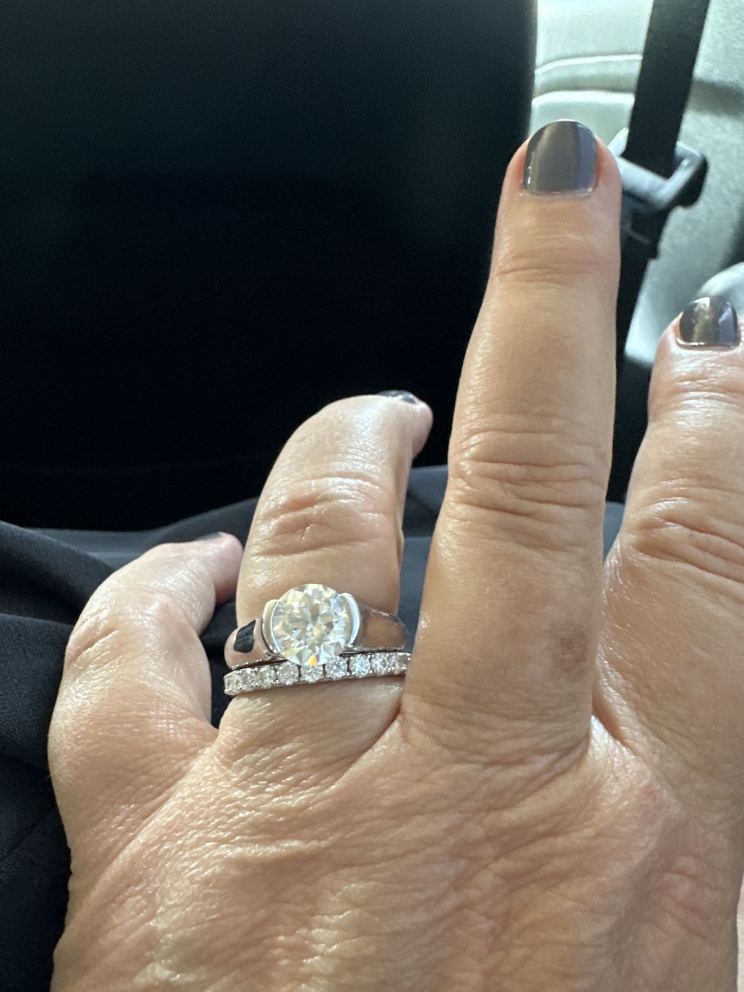 Customer photo review of Solitaire Moissanite Half Bezel Set Sterling Silver Engagement Ring