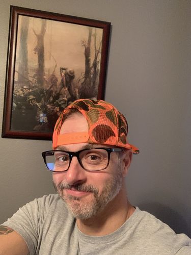 Customer photo review of Waylon Jennings Flying W Symbol Trucker Hat - Safety Orange Camo