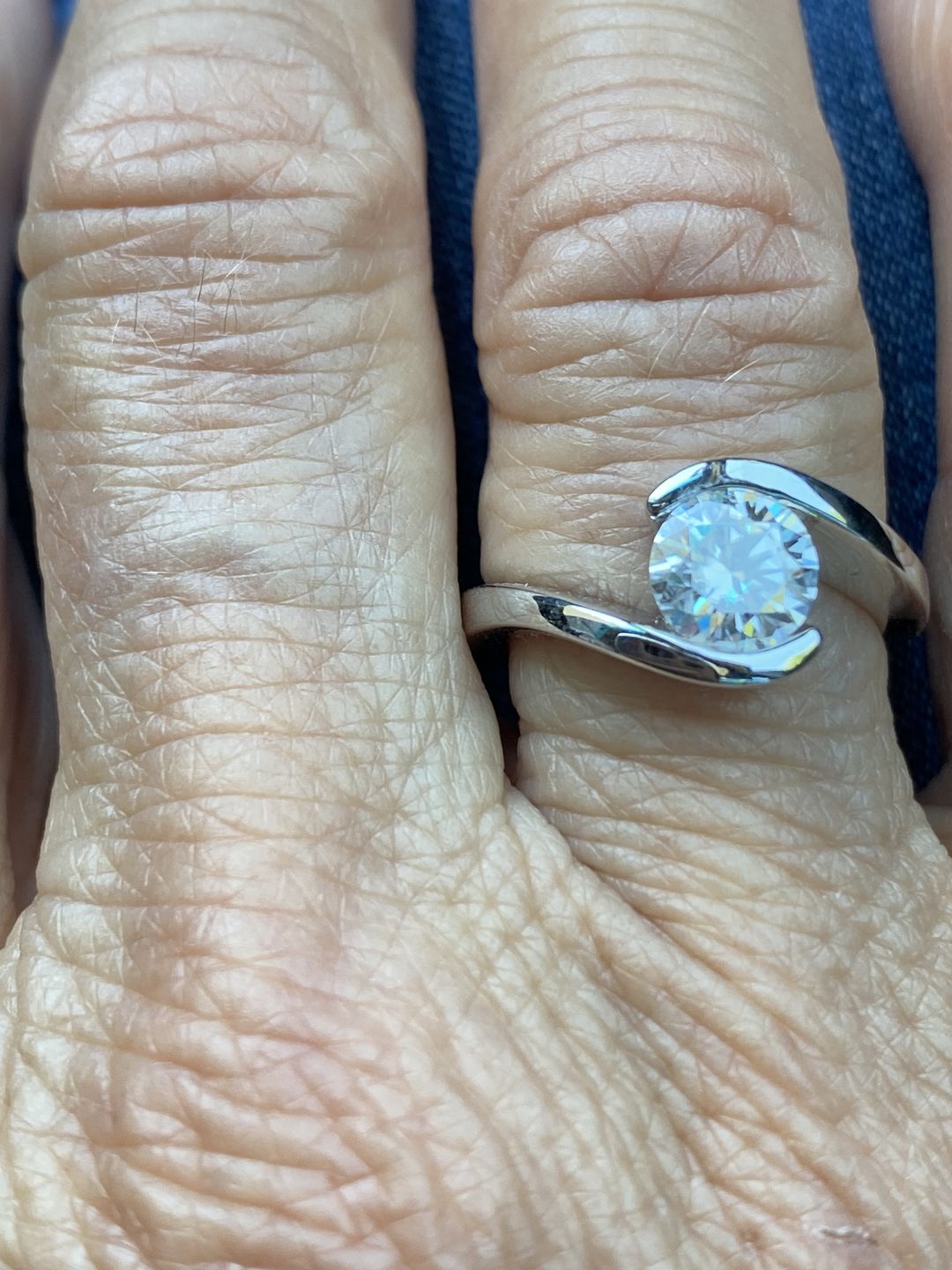 Customer photo review of Solitaire Tension Set Moissanite Bypass Engagement Ring